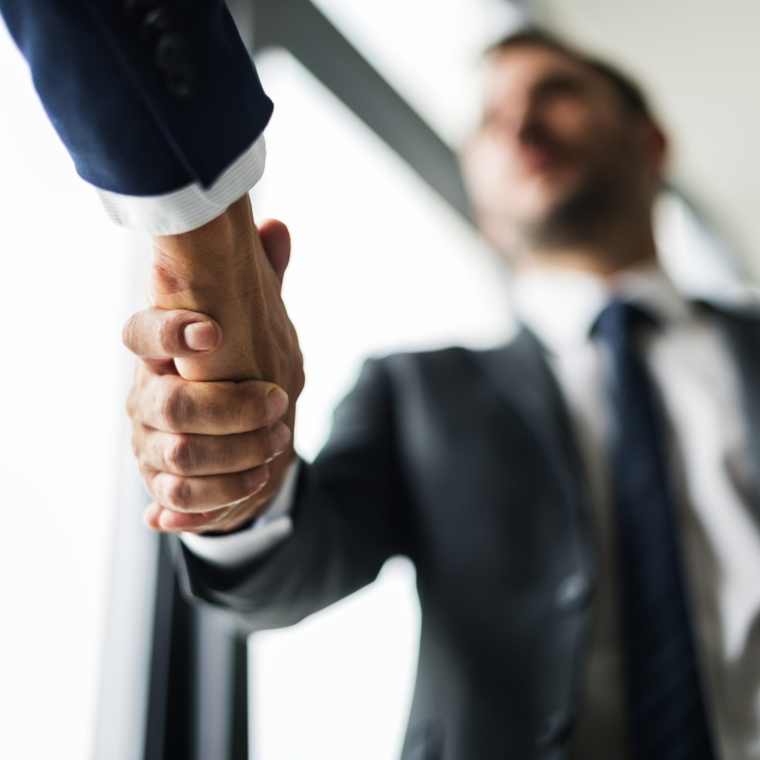 Image of two people shaking hands