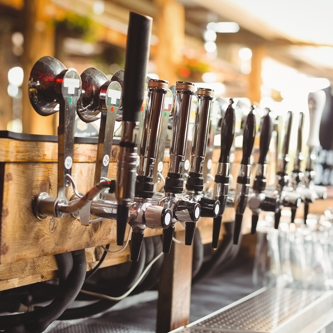 Close-up of beer pump in a row at bar