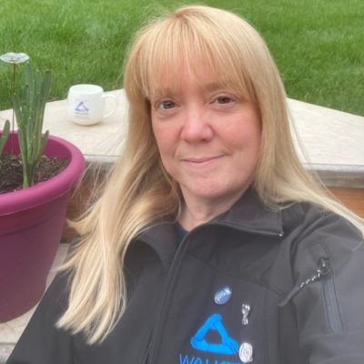 Former health and safety student Emma Woodhouse wearing a black top with a blue logo