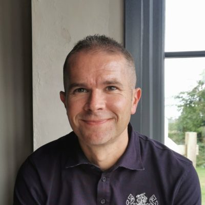 Leadership and management apprentice Stephen Morgan wearing a black top in front of a window