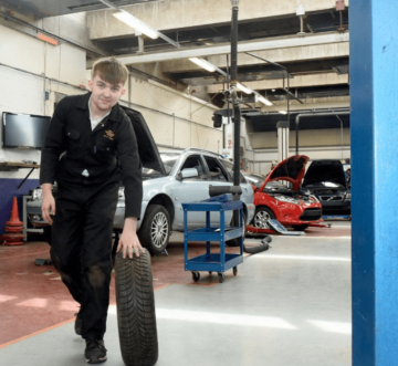 A student in a automotive workshop